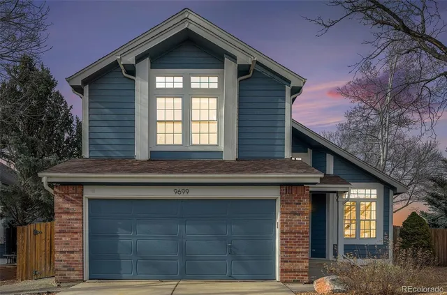a front view of a house with a garage