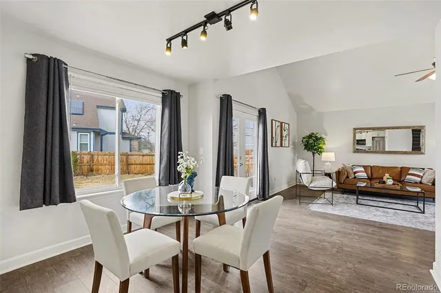 a living room with furniture and a table