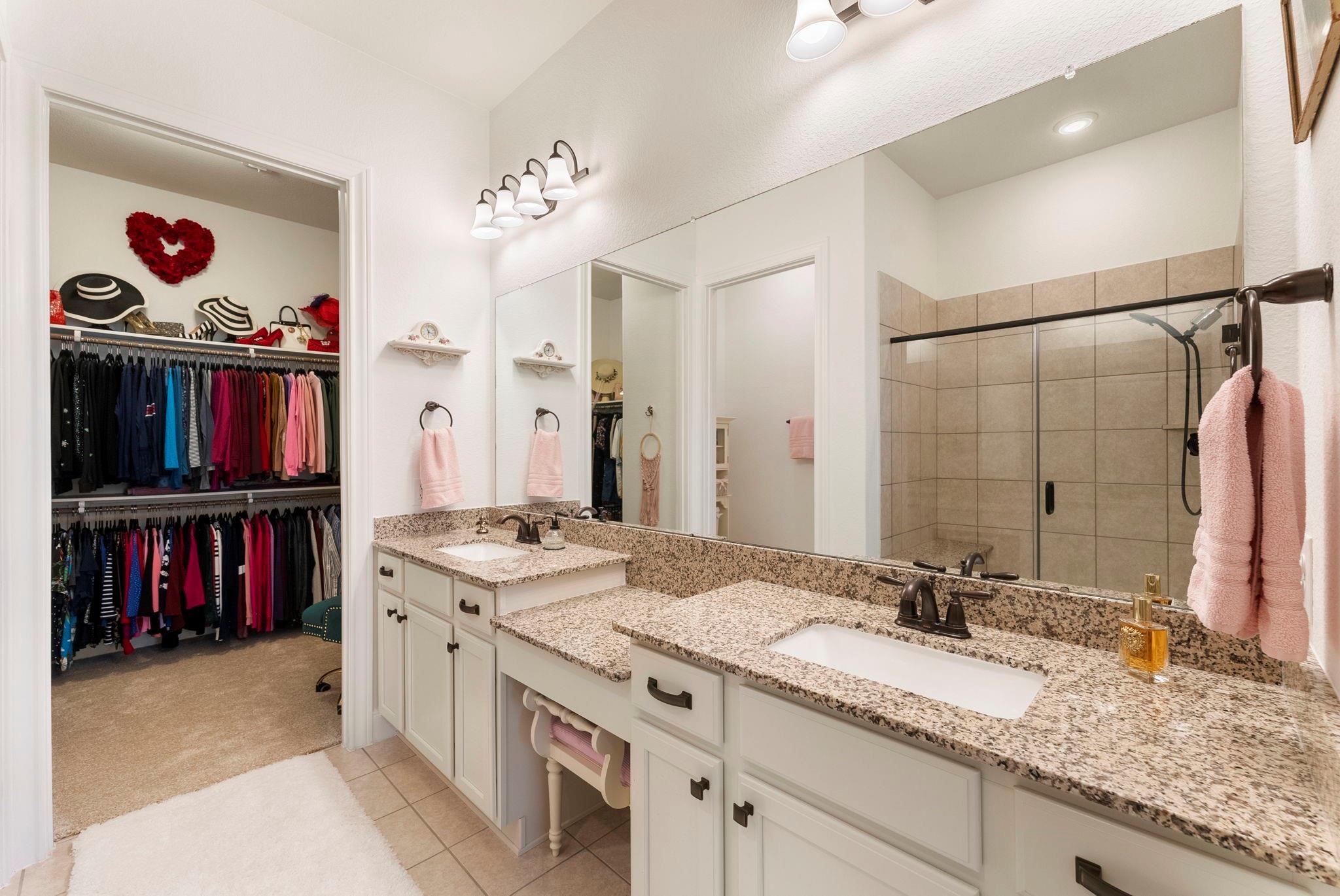 230 Galloway Court Spring, TX 77382 - Photo 19 of 32 a en suite bathroom with a granite countertop double vanity sink and a mirror