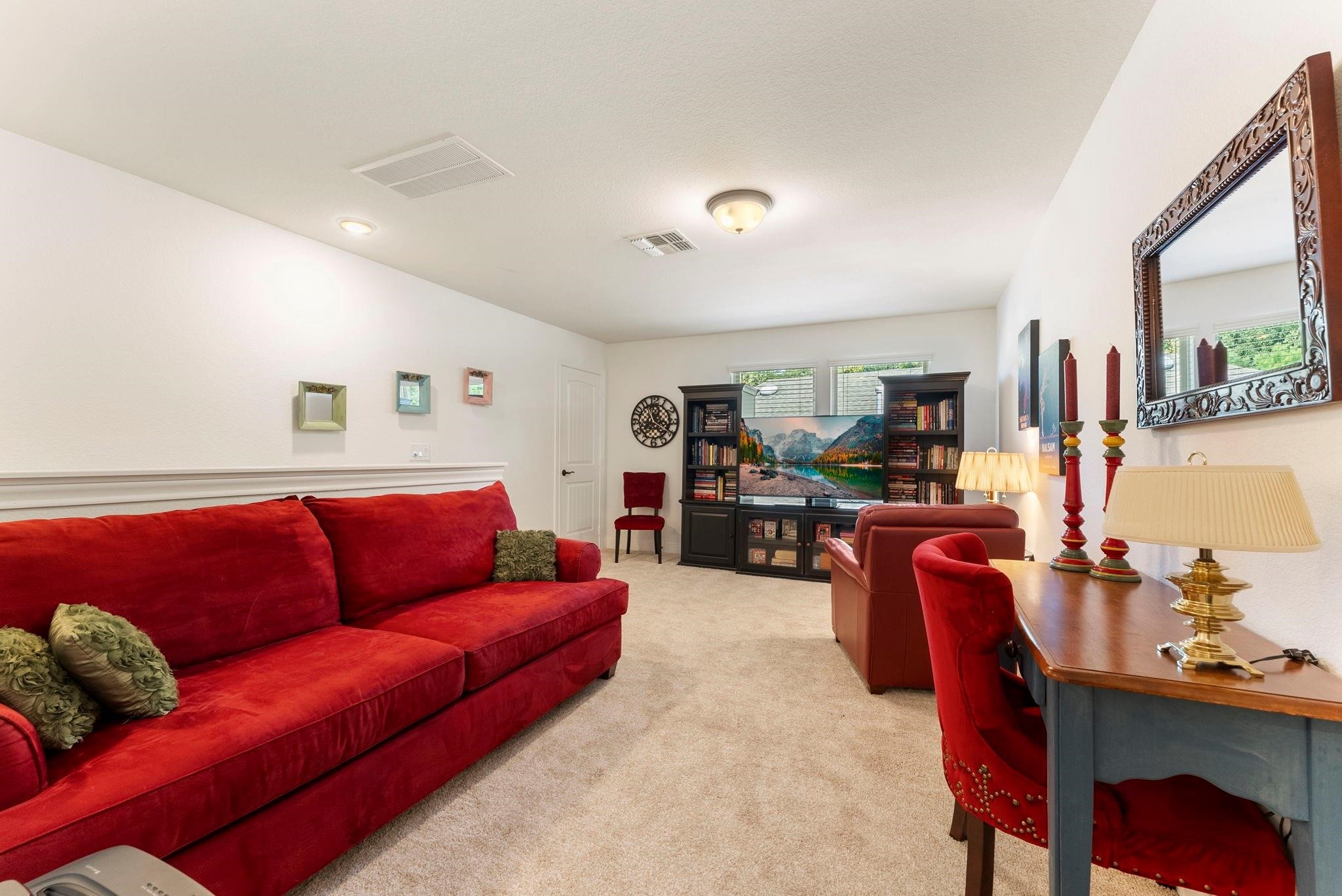 230 Galloway Court Spring, TX 77382 - Photo 26 of 32 a living room with furniture and a flat screen tv