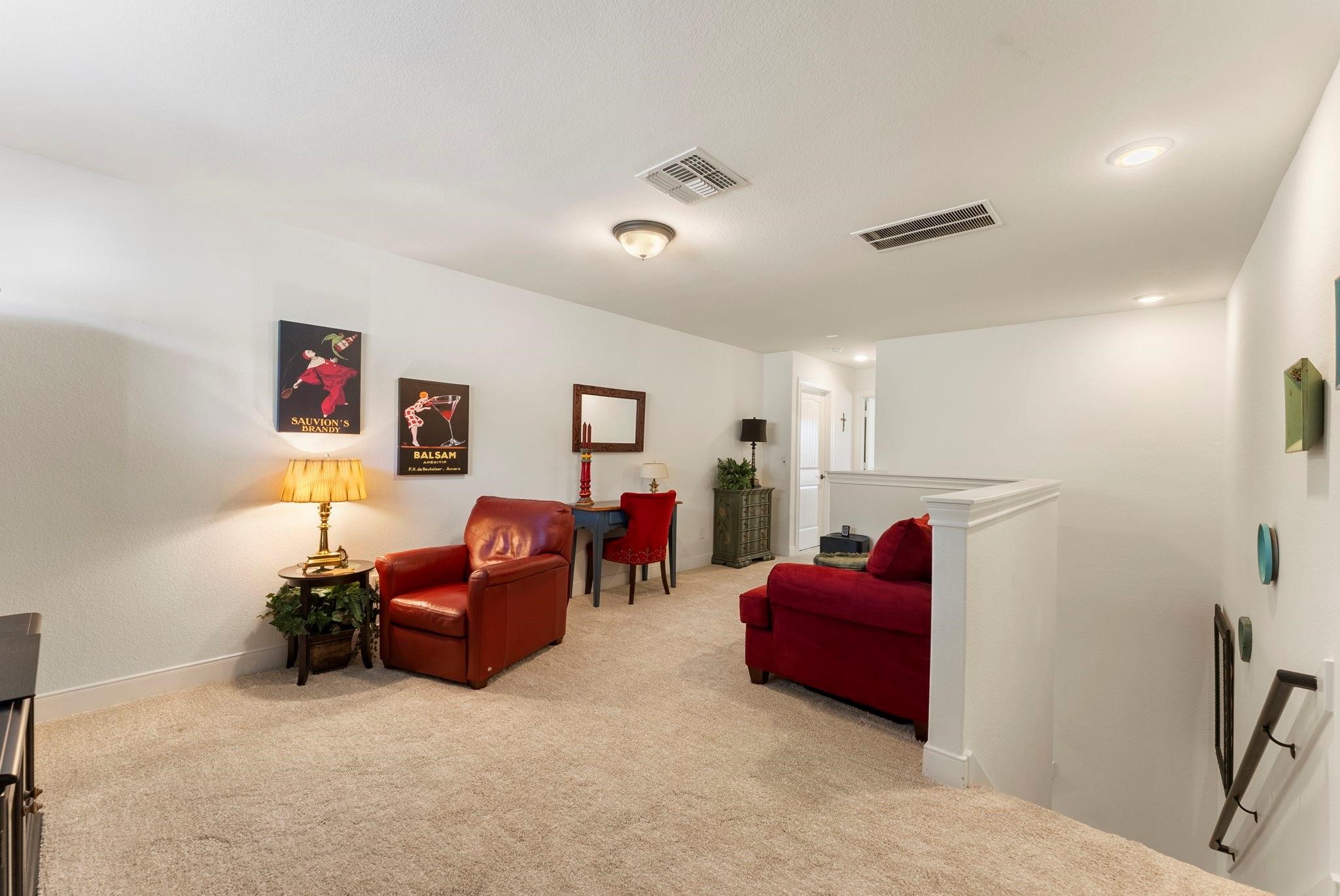 230 Galloway Court Spring, TX 77382 - Photo 27 of 32 a living room with furniture and a flat screen tv
