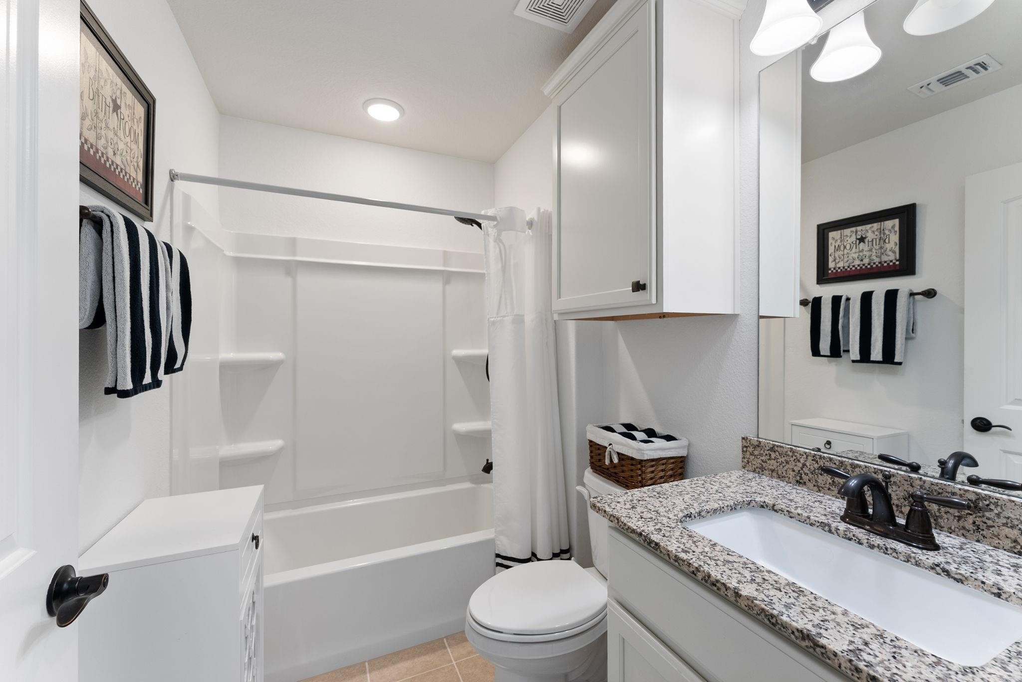 230 Galloway Court Spring, TX 77382 - Photo 29 of 32 a bathroom with a granite countertop sink toilet and shower