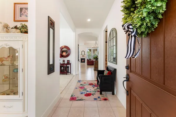 a living room with furniture and a dresser