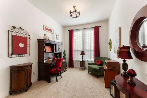 a living room with fireplace furniture and a flat screen tv