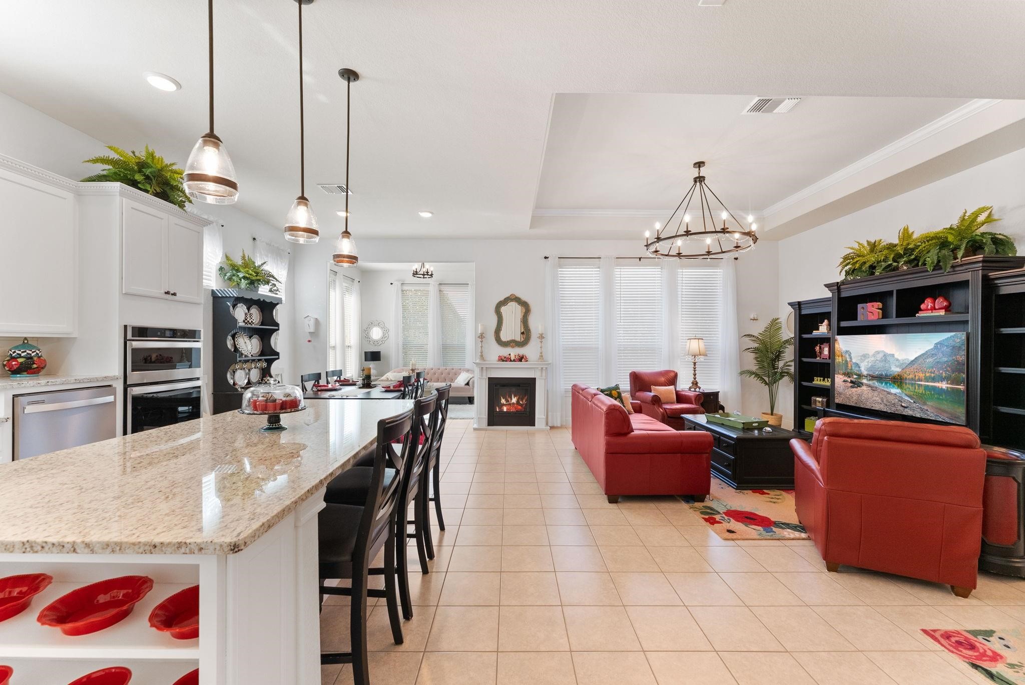 230 Galloway Court Spring, TX 77382 - Photo 7 of 32 a living room with fireplace furniture and a flat screen tv