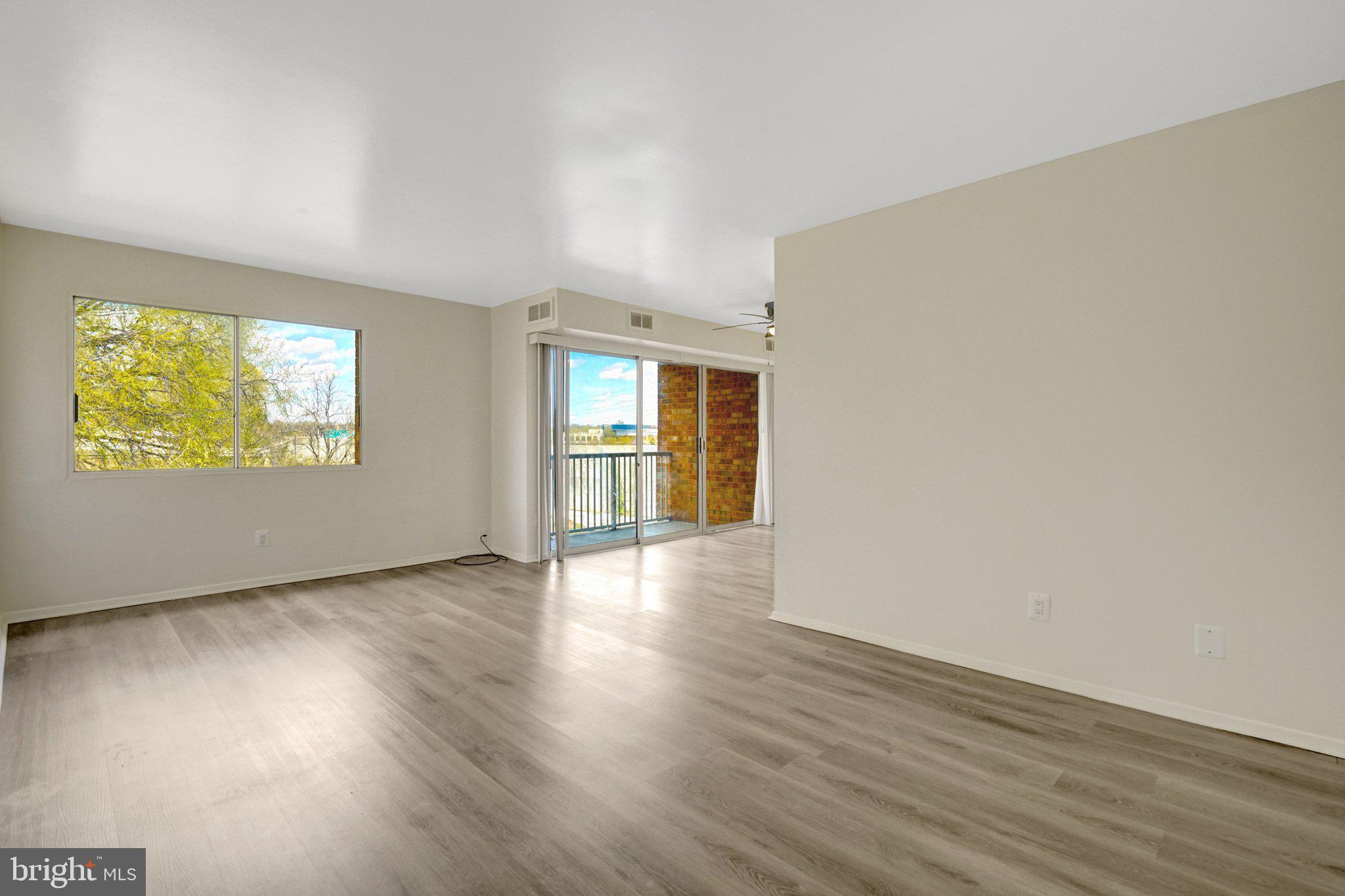 2904 Kings Chapel Road, Unit 5/16 Falls Church, VA 22042 - Photo 1 of 30 a view of an empty room with wooden floor and a window