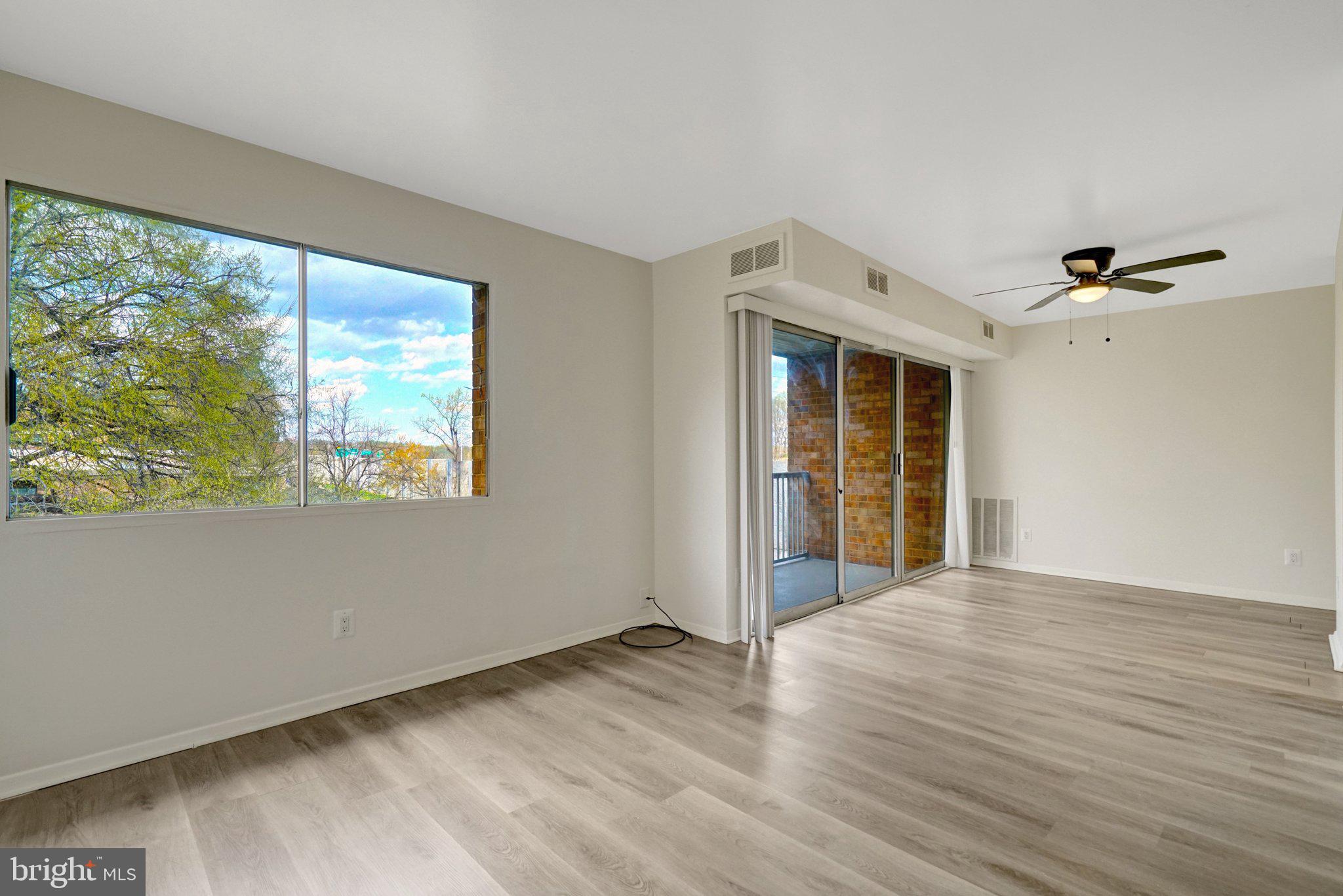 2904 Kings Chapel Road, Unit 5/16 Falls Church, VA 22042 - Photo 11 of 30 a view of an empty room with wooden floor and a window