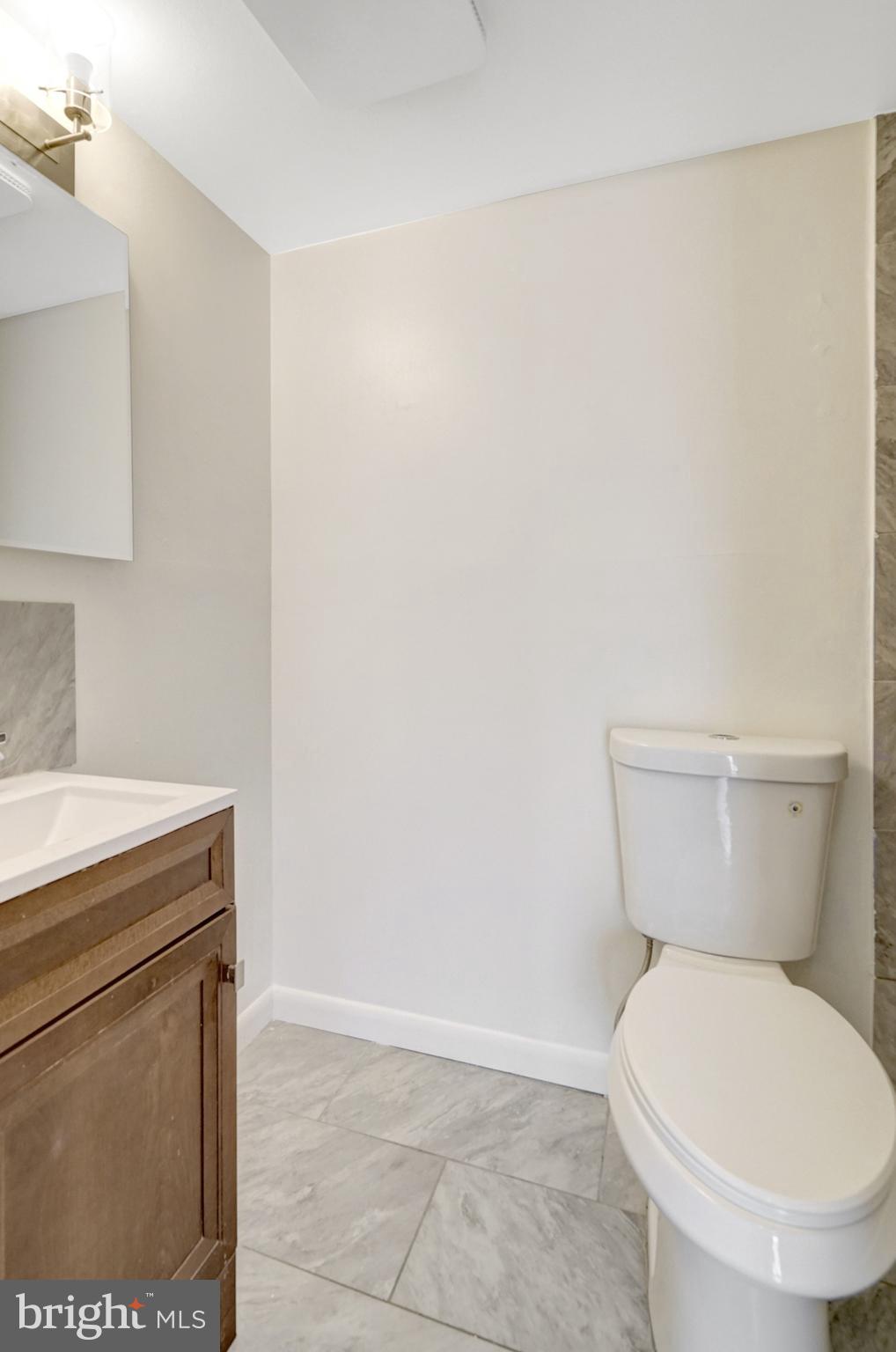 2904 Kings Chapel Road, Unit 5/16 Falls Church, VA 22042 - Photo 15 of 30 a bathroom with a toilet and a sink