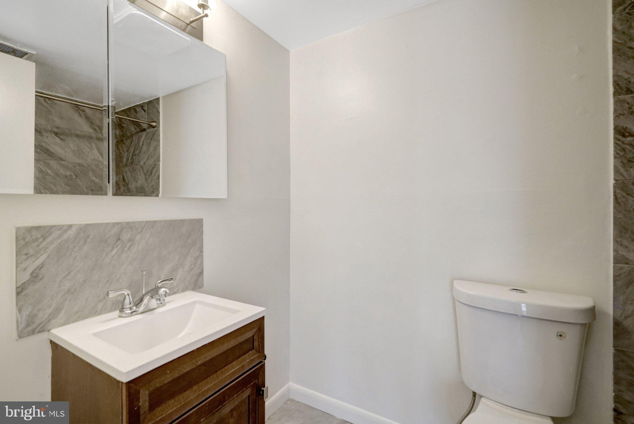 2904 Kings Chapel Road, Unit 5/16 Falls Church, VA 22042 - Photo 17 of 30 a bathroom with a sink toilet and vanity