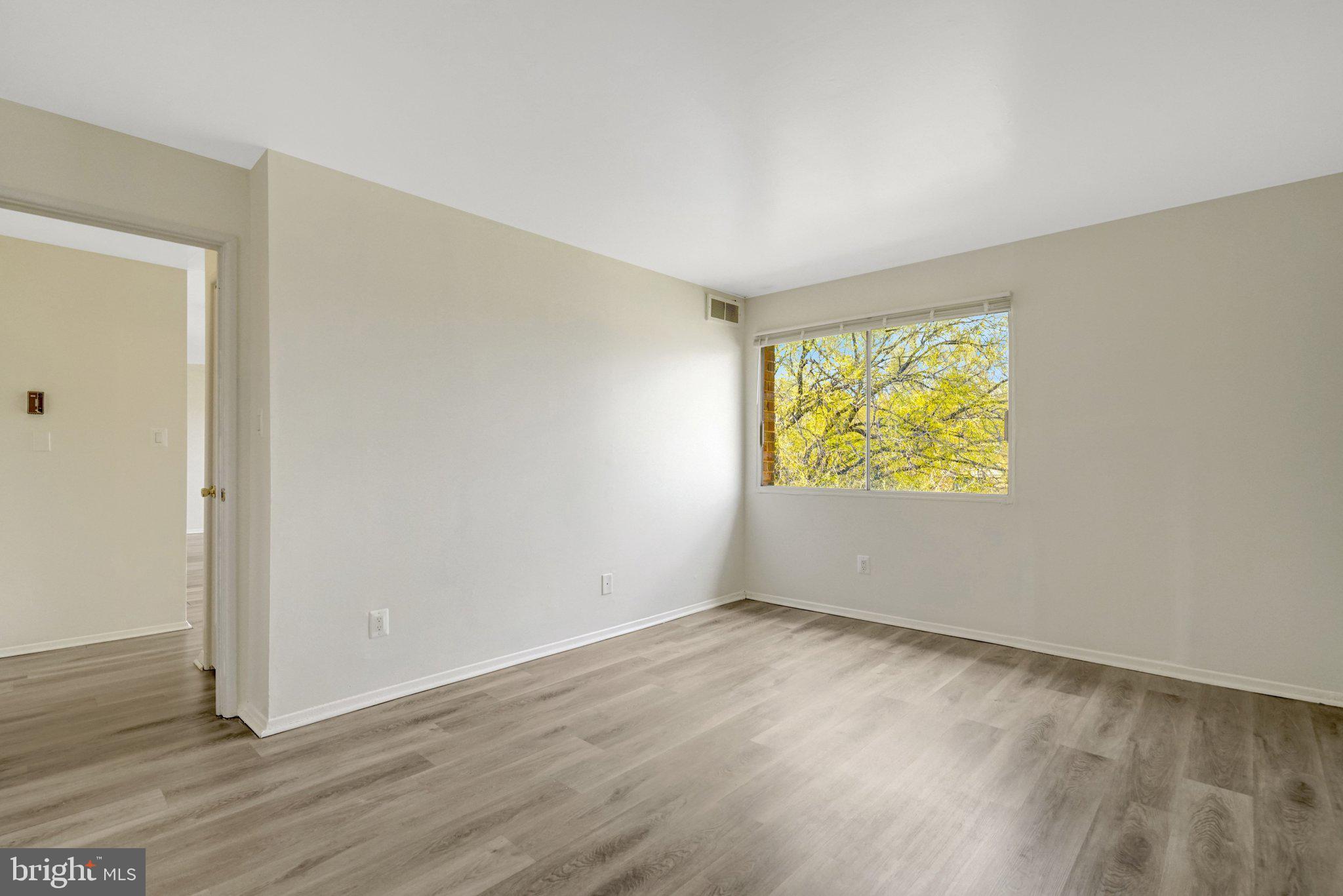 2904 Kings Chapel Road, Unit 5/16 Falls Church, VA 22042 - Photo 20 of 30 an empty room with wooden floor and windows