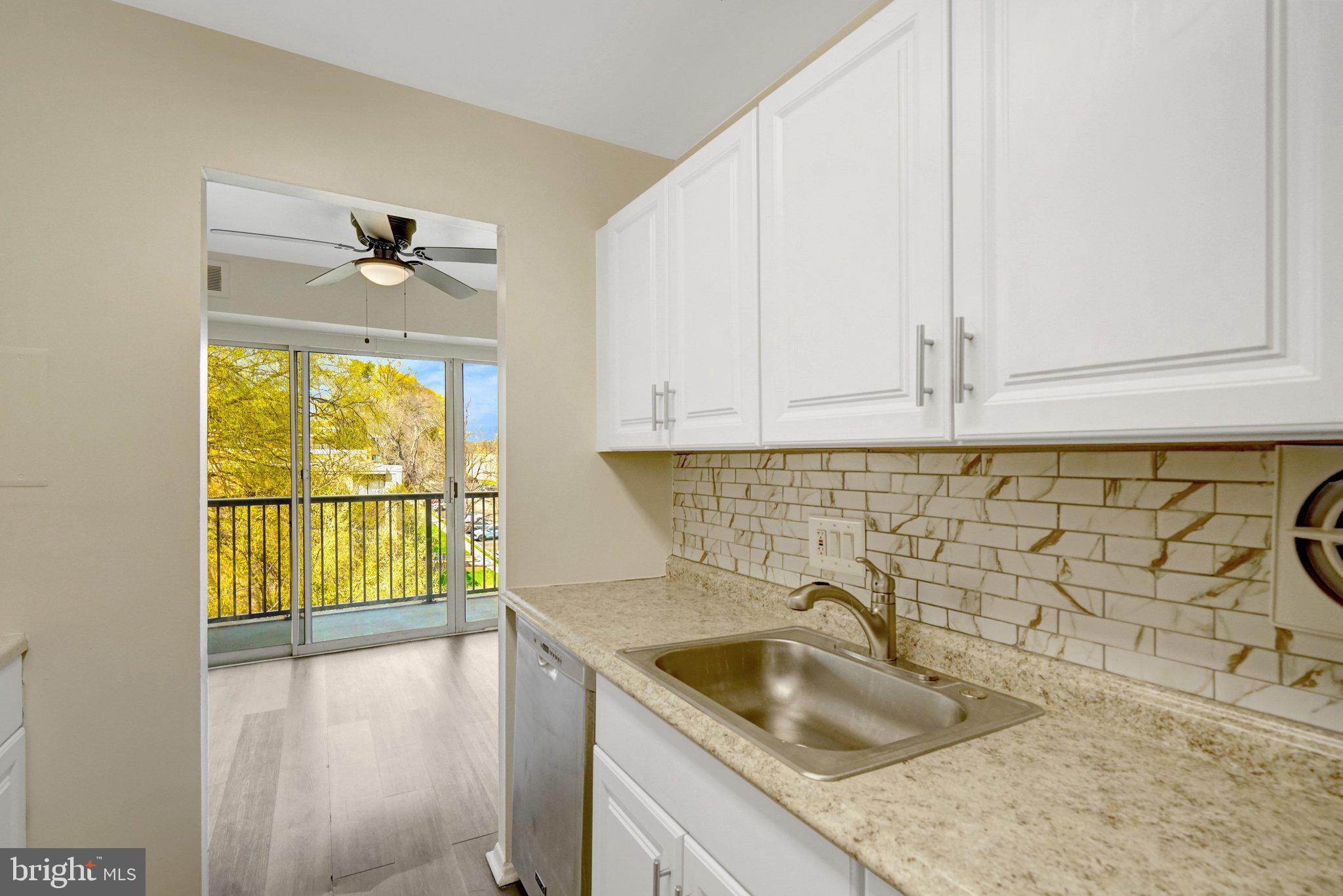 2904 Kings Chapel Road, Unit 5/16 Falls Church, VA 22042 - Photo 6 of 30 a kitchen with a sink a stove and cabinets