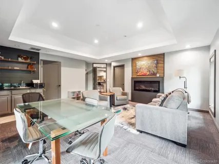 a living room with fireplace furniture and a flat screen tv