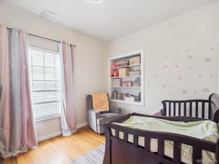 a bedroom with a bed and a table in it