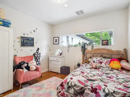 a bedroom with bed and window