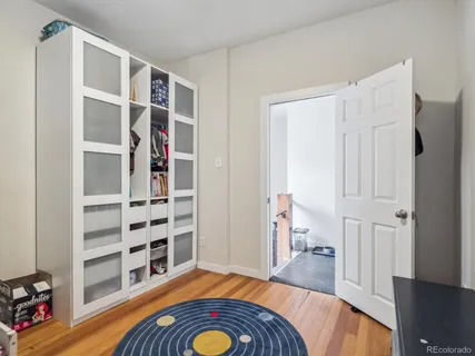 a room with a bed and furniture