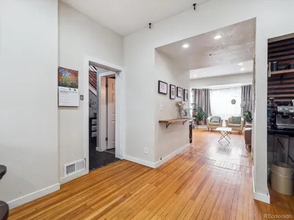 a view of a living room and dining room