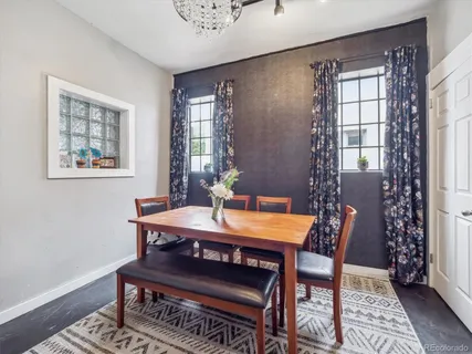 a view of a dining room with furniture and window