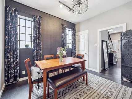 a dining room with furniture and window