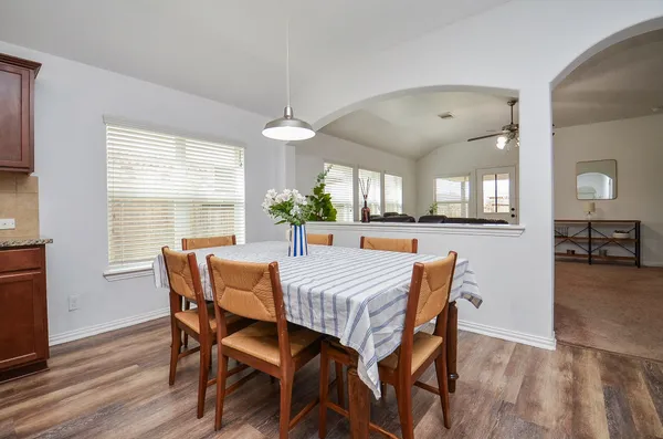 a view of a dining room with furniture window and wooden floor