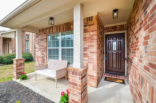 a outdoor living area with furniture and a window