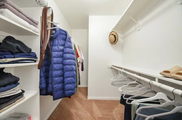 a view of staircase with white walls