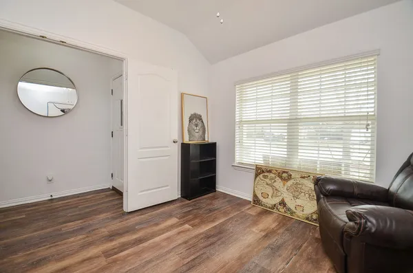 a view of a livingroom with furniture and wooden floor