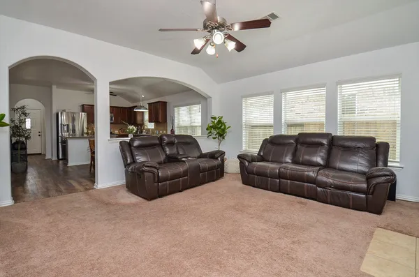 a living room with furniture and a large window