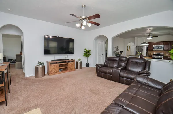 a living room with furniture and a flat screen tv