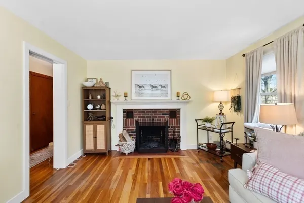 a bedroom with a bed a window and chair