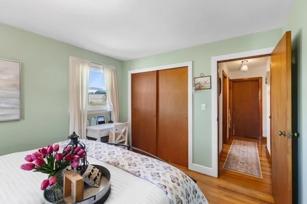 a bathroom with a toilet and a shower curtain