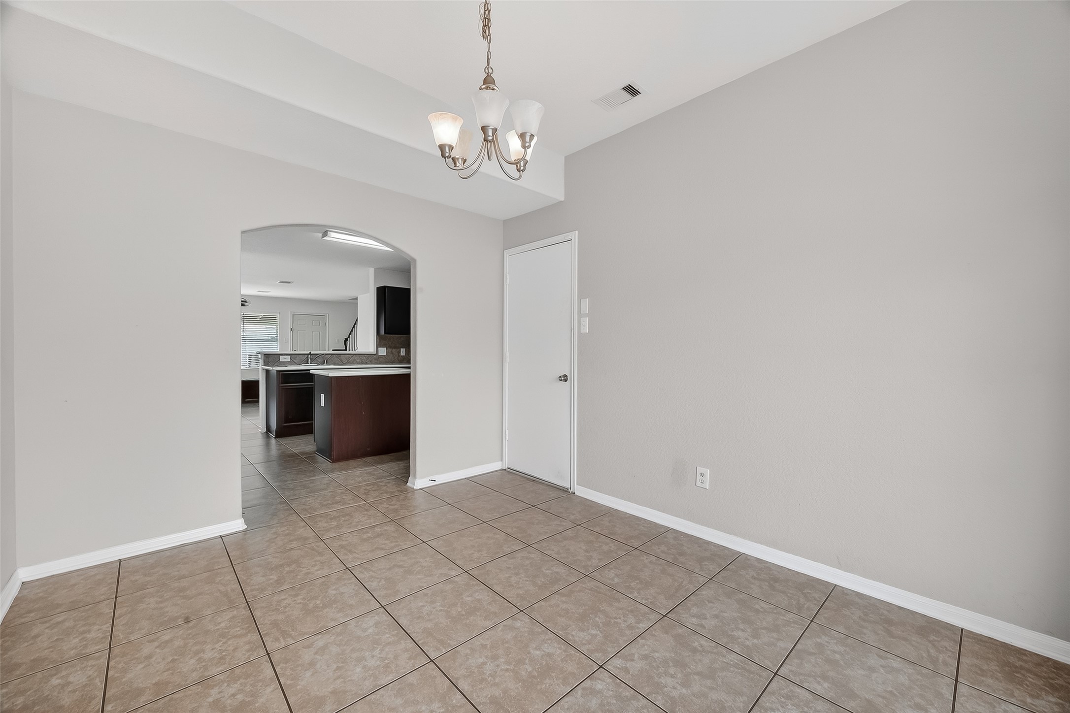 3131 Upland Spring Trace Katy, TX 77493 - Photo 17 of 48 a view of a kitchen with a sink and a chandelier