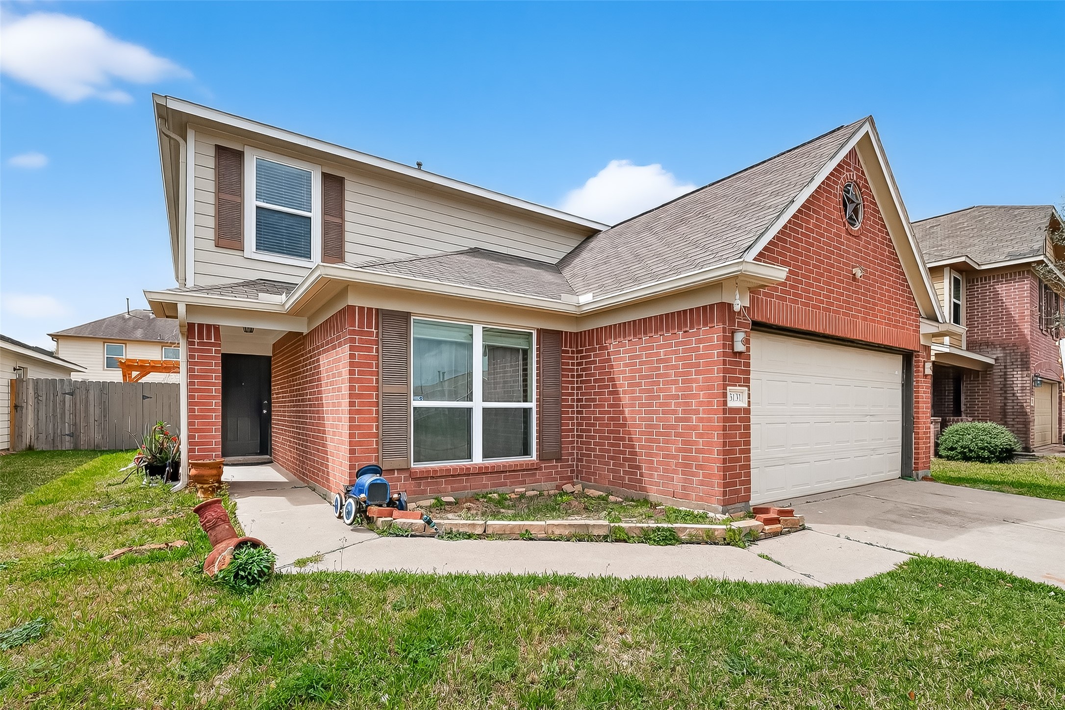 3131 Upland Spring Trace Katy, TX 77493 - Photo 2 of 48 front view of a house with a yard