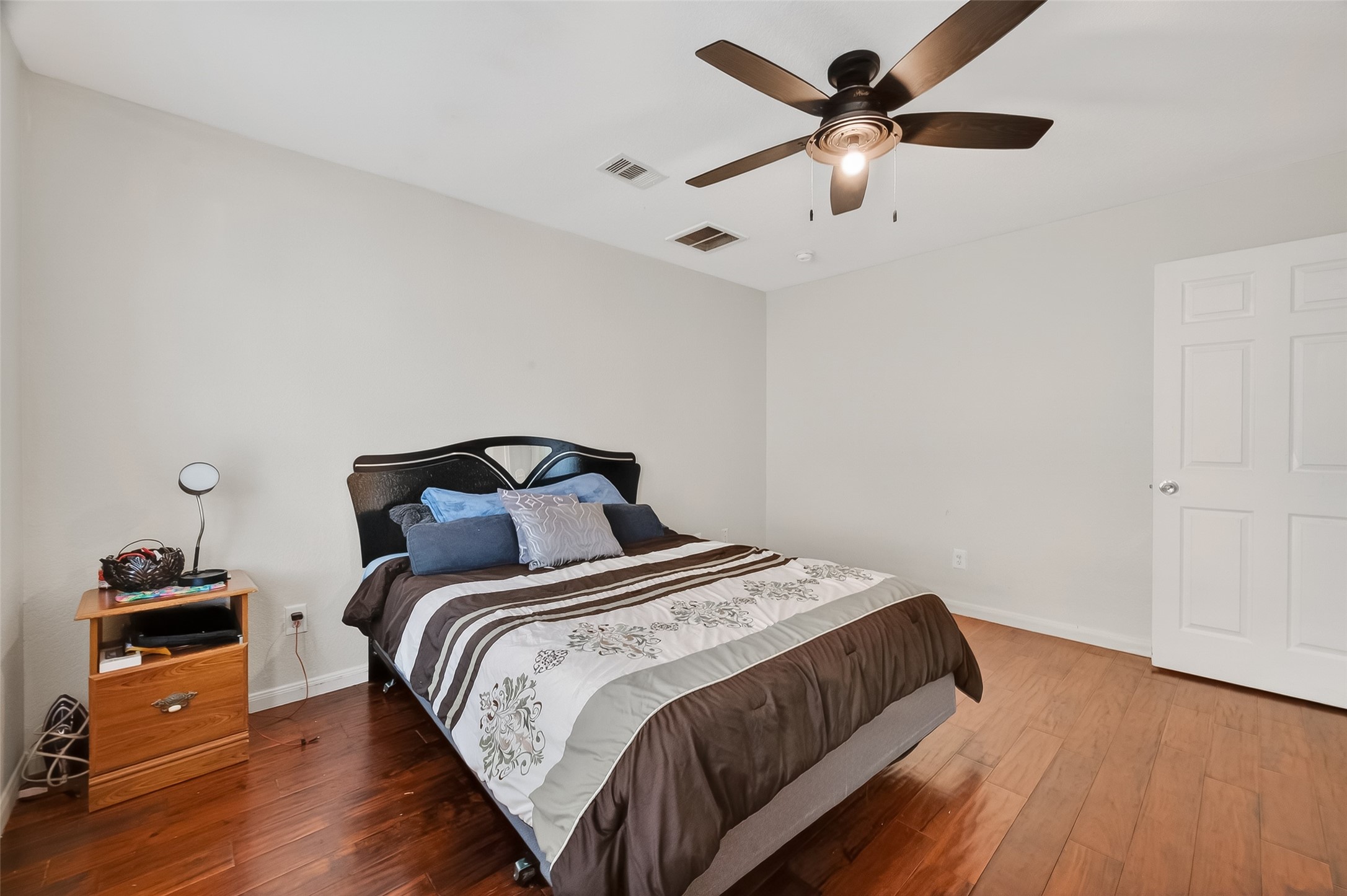3131 Upland Spring Trace Katy, TX 77493 - Photo 21 of 48 a bedroom with bed and a chandelier