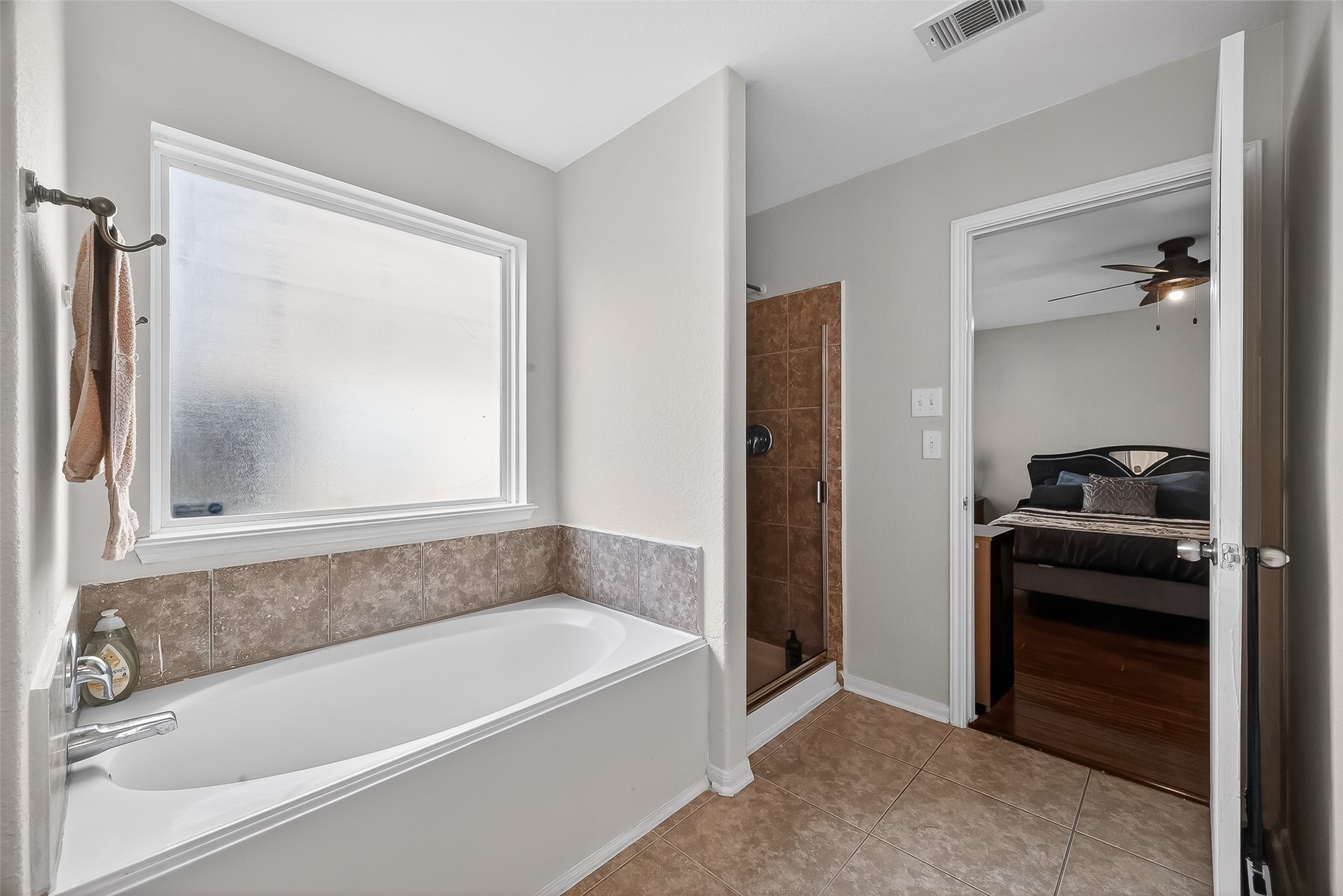 3131 Upland Spring Trace Katy, TX 77493 - Photo 24 of 48 a bathroom with a bathtub and a shower