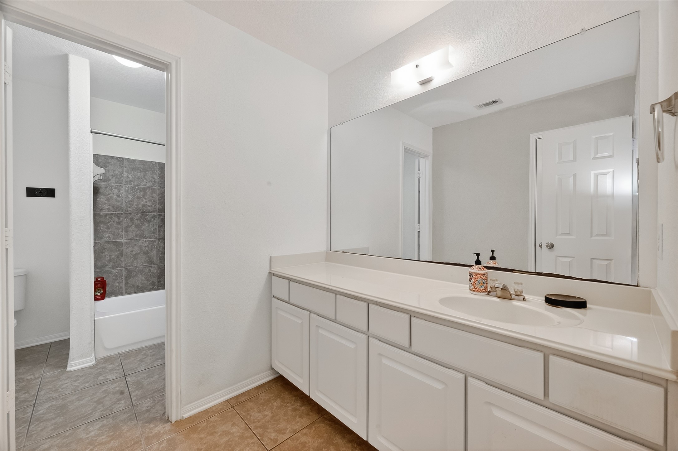 3131 Upland Spring Trace Katy, TX 77493 - Photo 28 of 48 a bathroom with a sink and a mirror