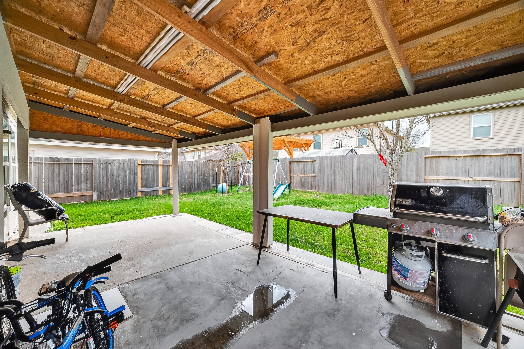 3131 Upland Spring Trace Katy, TX 77493 - Photo 41 of 48 a view of a patio with a table and chairs