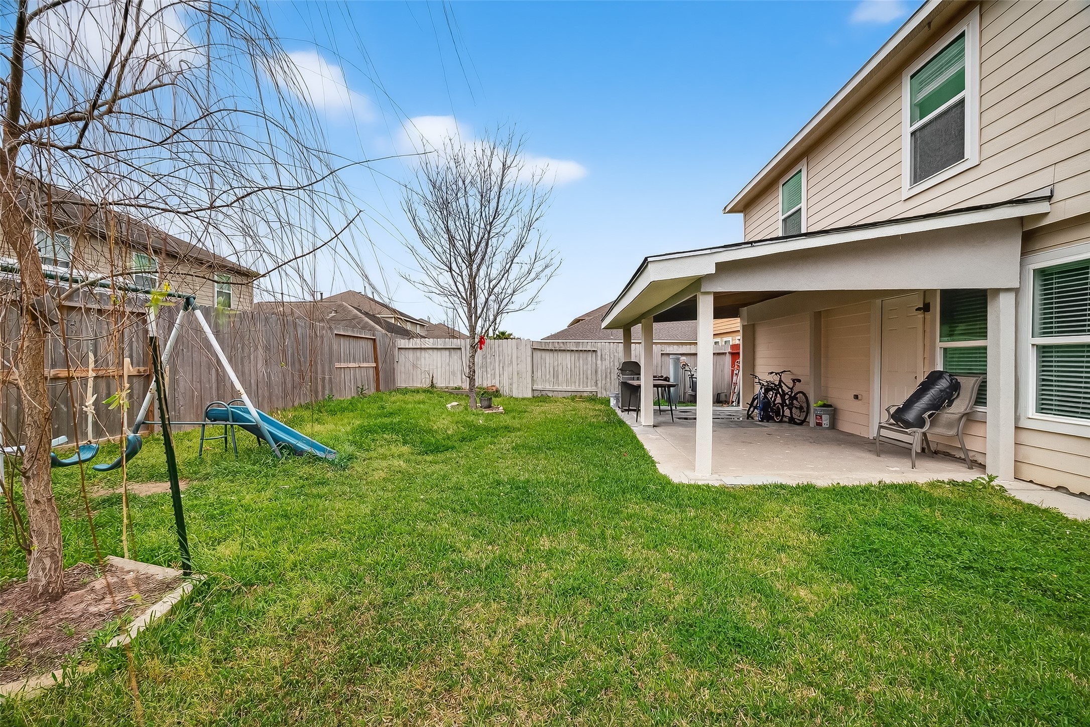 3131 Upland Spring Trace Katy, TX 77493 - Photo 44 of 48 a view of a house with backyard porch and sitting area