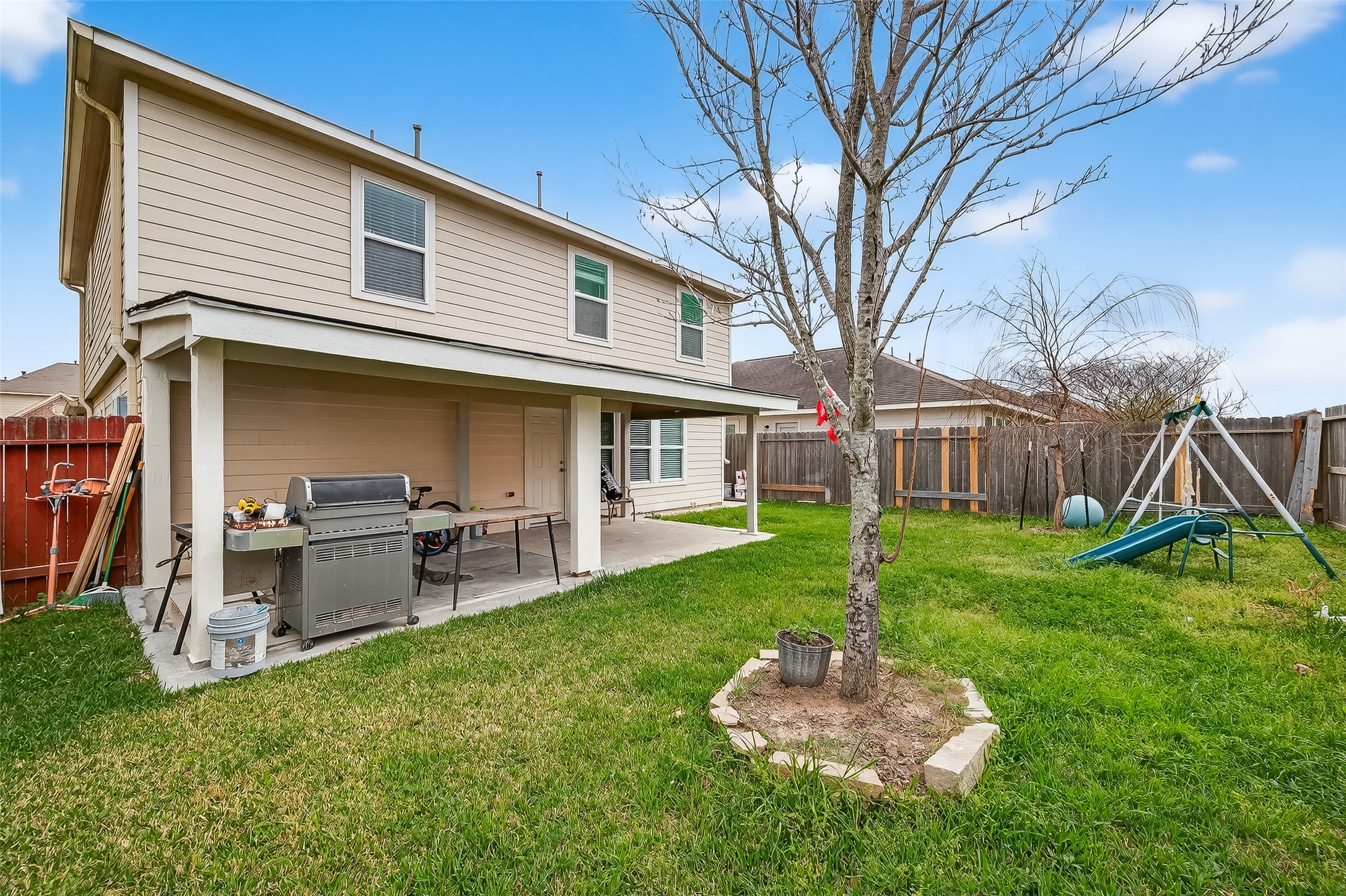 3131 Upland Spring Trace Katy, TX 77493 - Photo 45 of 48 a backyard of a house with table and chairs