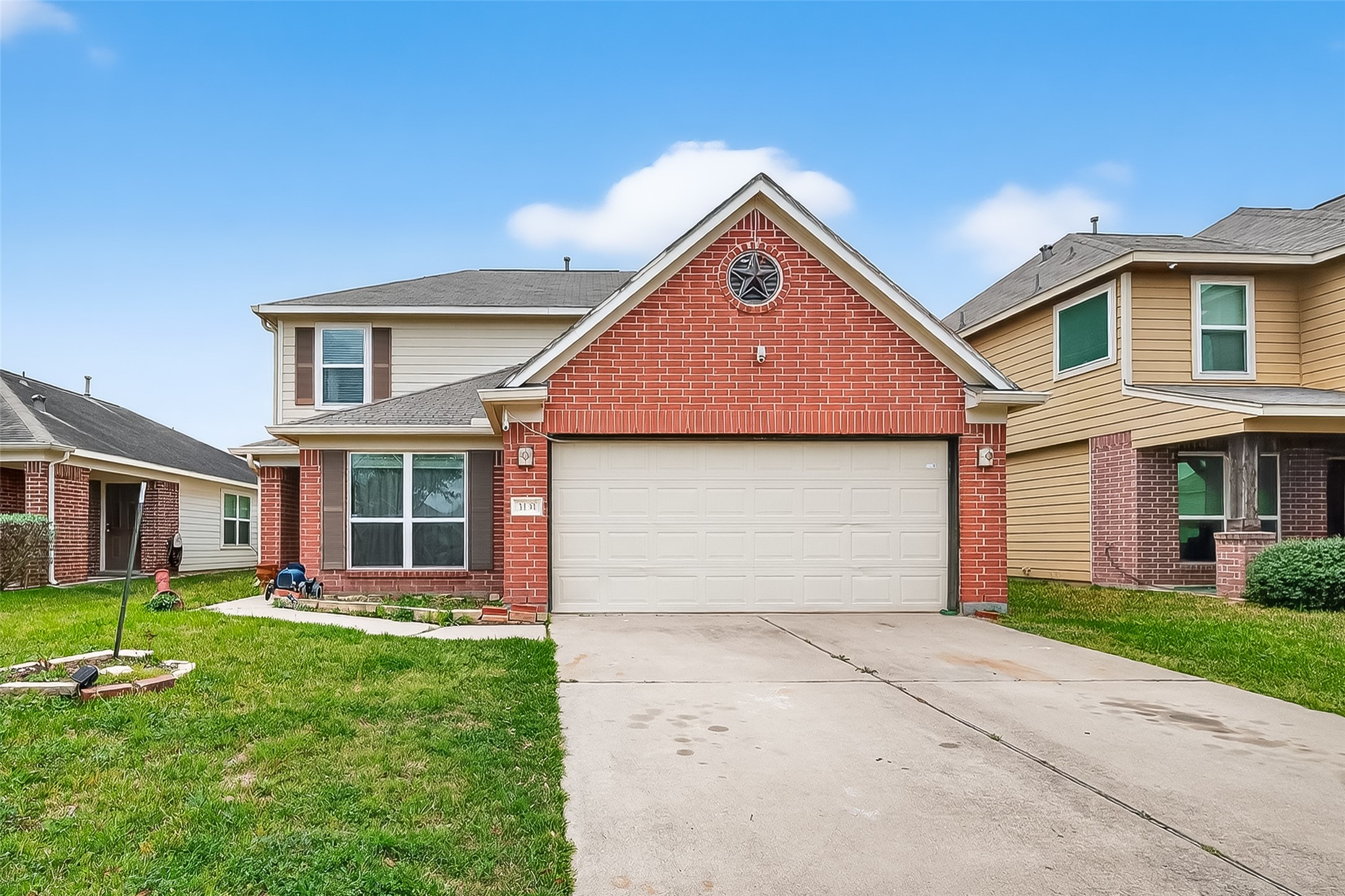 3131 Upland Spring Trace Katy, TX 77493 - Photo 5 of 48 a front view of a house with a yard and garage