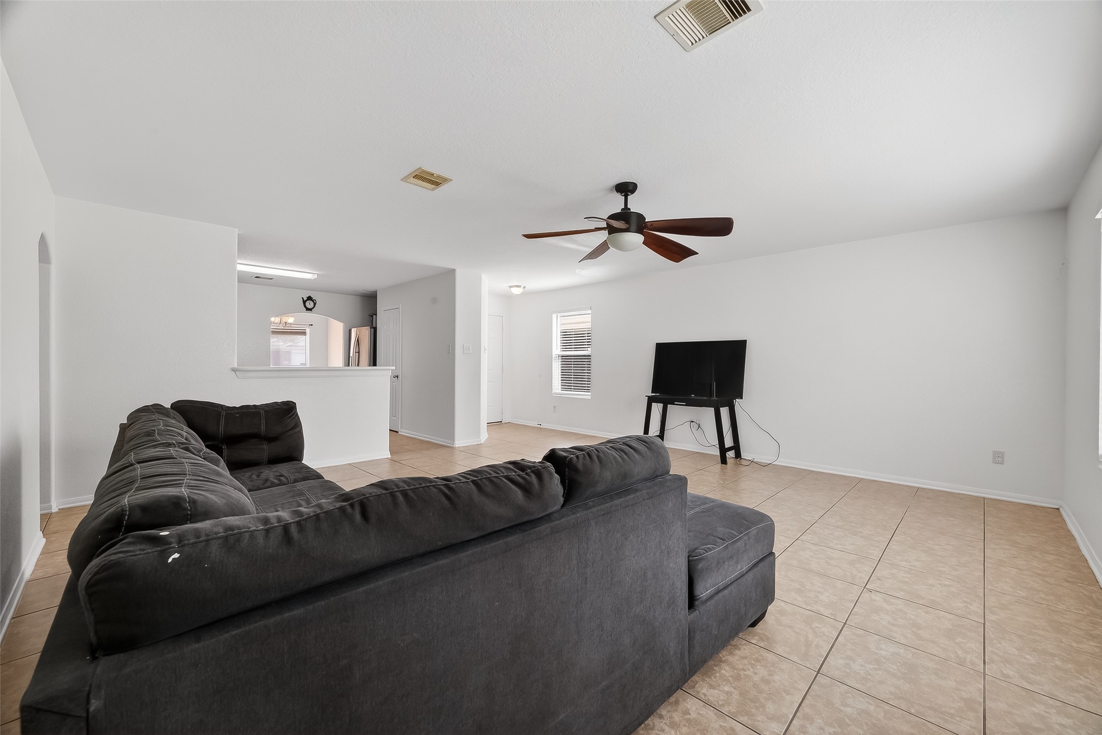 3131 Upland Spring Trace Katy, TX 77493 - Photo 7 of 48 a living room with furniture and a lamp