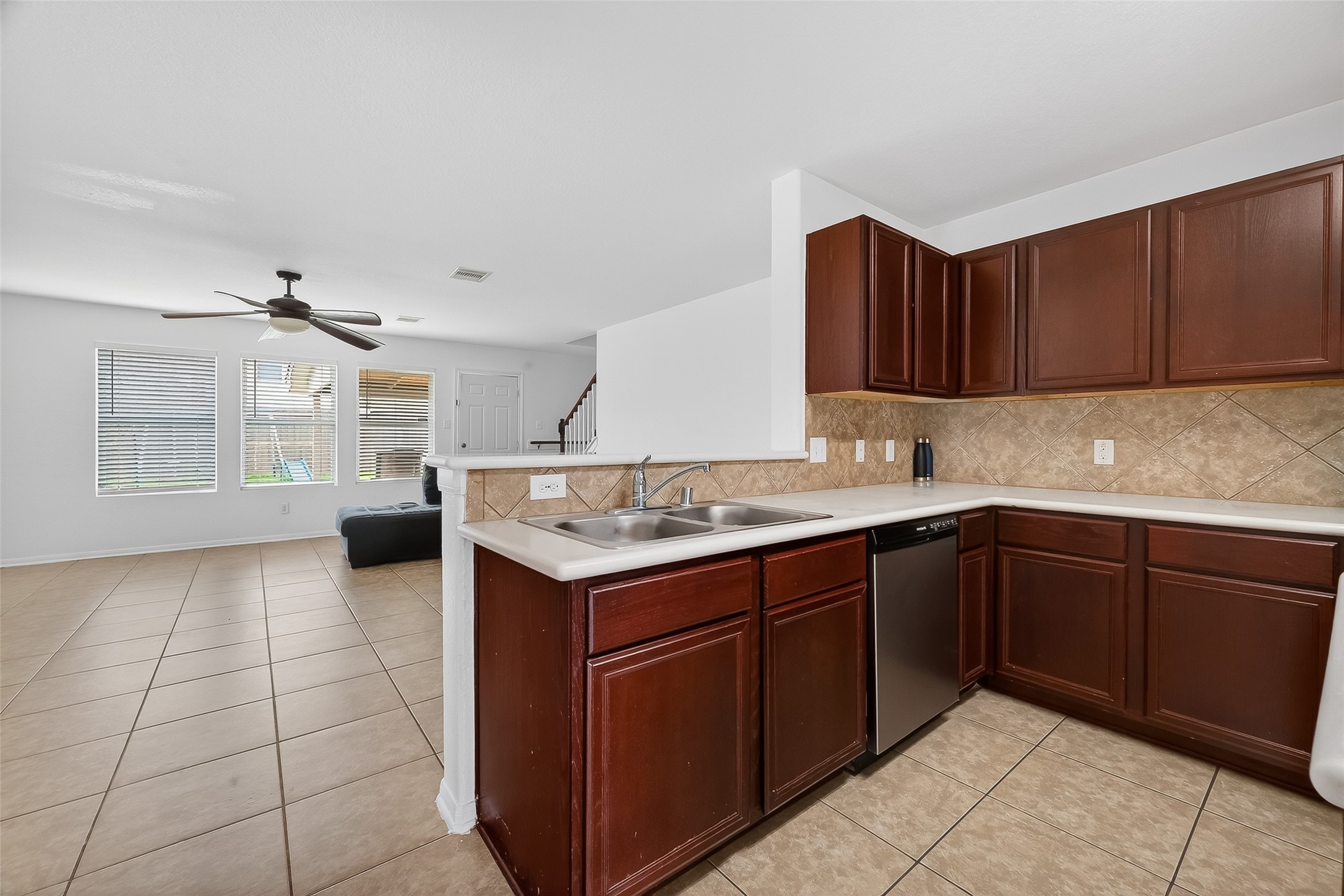 3131 Upland Spring Trace Katy, TX 77493 - Photo 9 of 48 a kitchen with a sink and cabinets
