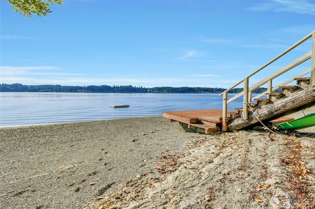 a swimming pool with an outdoor space and seating