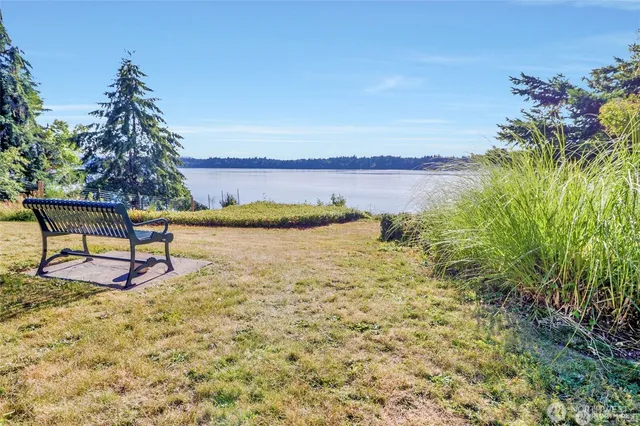 an aerial view of residential houses with yard