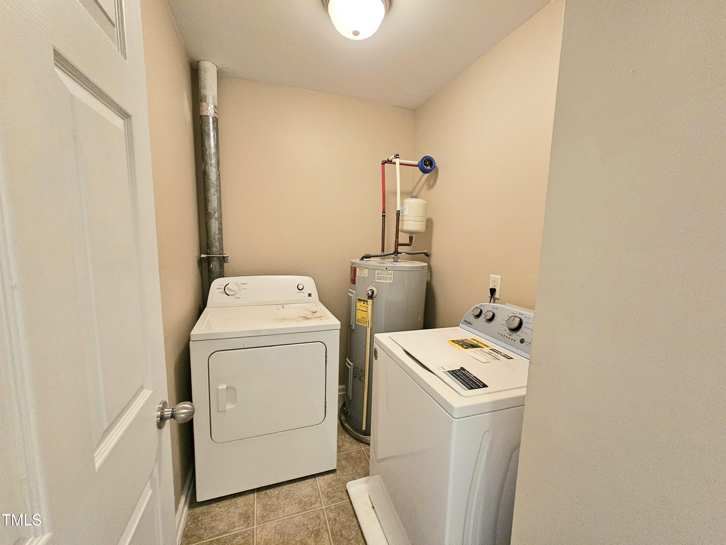 2220 Valley Edge Drive, Unit 107 Raleigh, NC 27614 - Photo 12 of 24 a utility room with dryer and washer