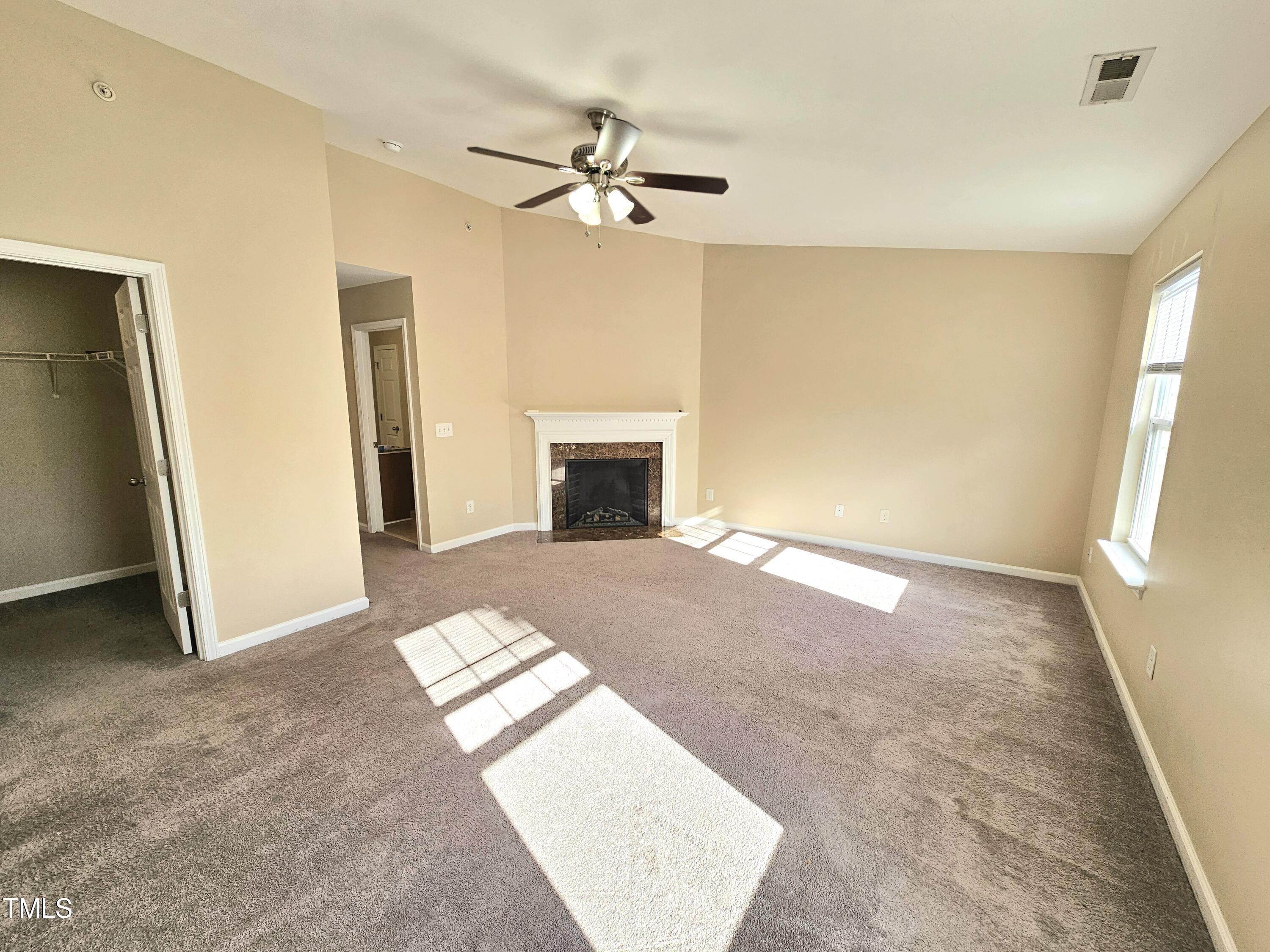 2220 Valley Edge Drive, Unit 107 Raleigh, NC 27614 - Photo 18 of 24 a view of an empty room with a fireplace
