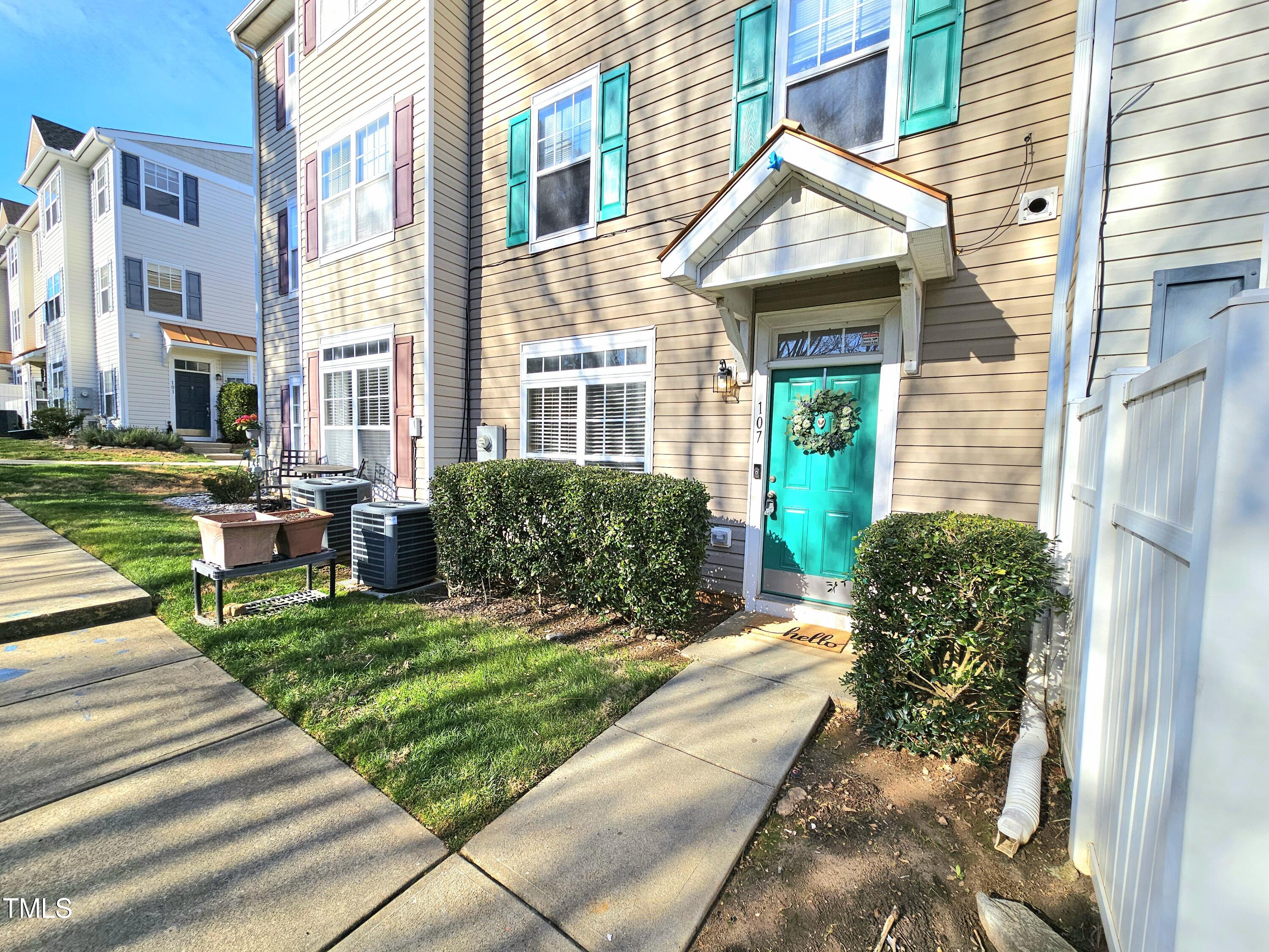 2220 Valley Edge Drive, Unit 107 Raleigh, NC 27614 - Photo 2 of 24 a house view with a garden space