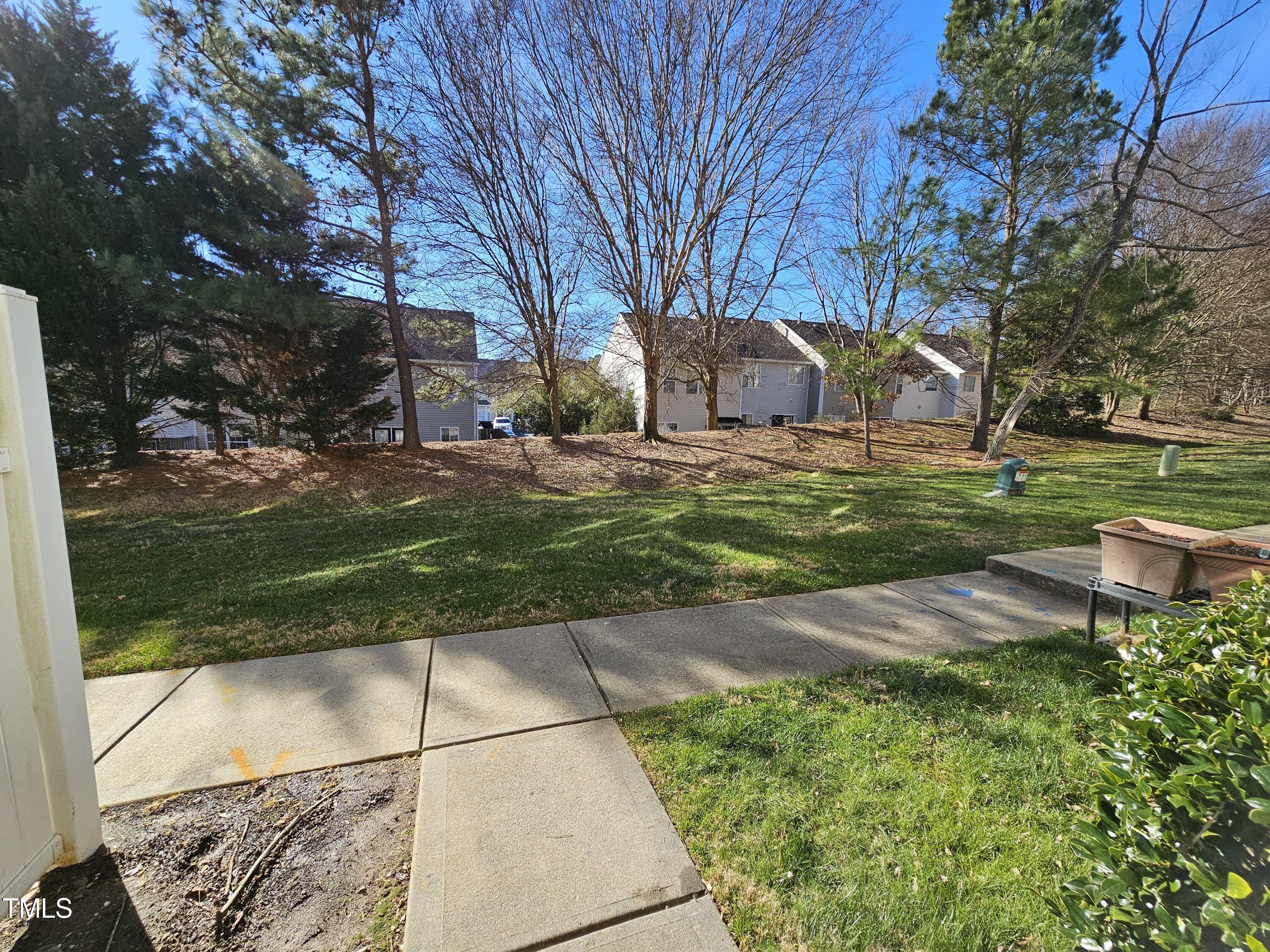 2220 Valley Edge Drive, Unit 107 Raleigh, NC 27614 - Photo 22 of 24 a front view of a house with garden
