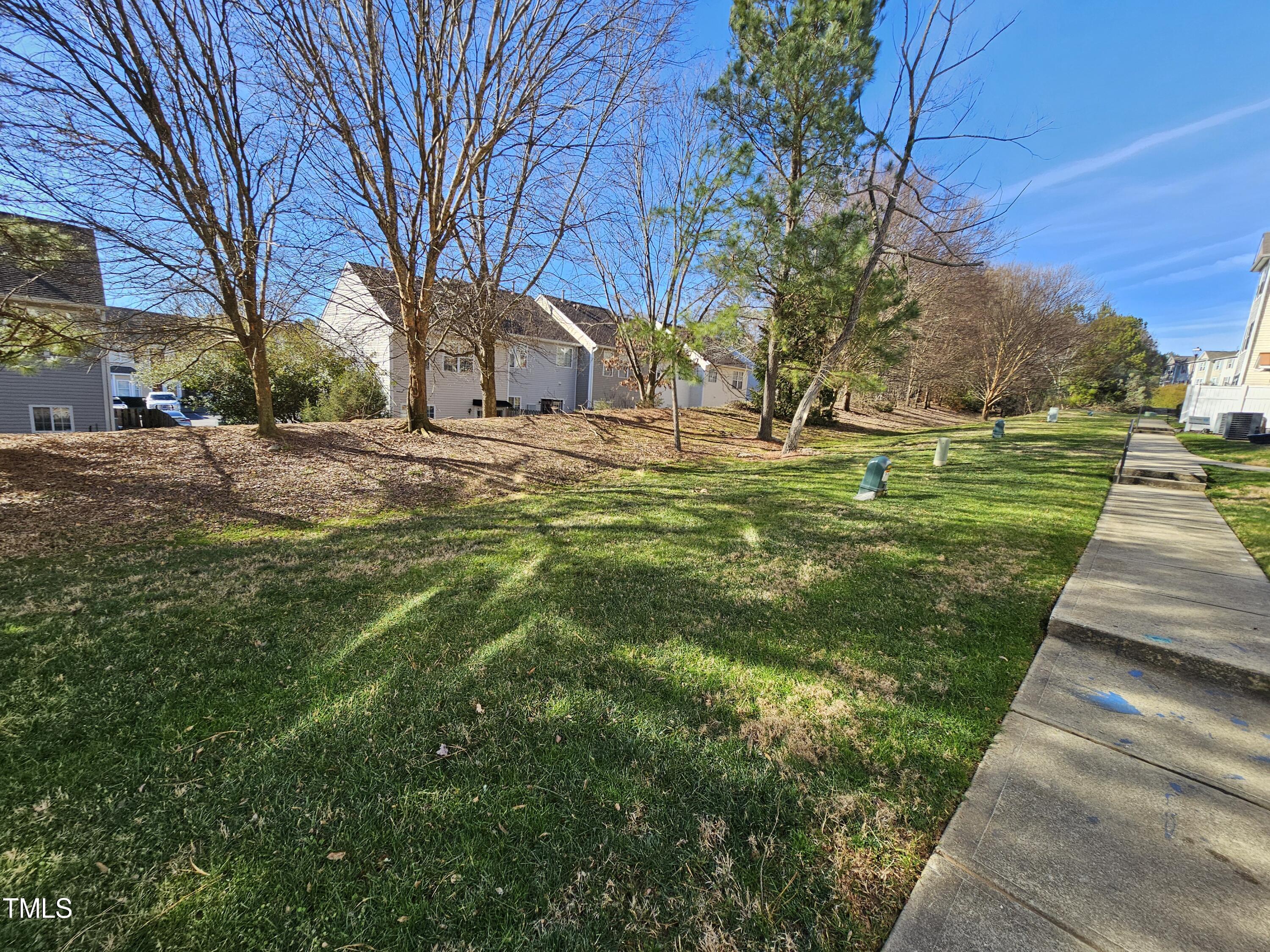 2220 Valley Edge Drive, Unit 107 Raleigh, NC 27614 - Photo 23 of 24 a view of yard with tree
