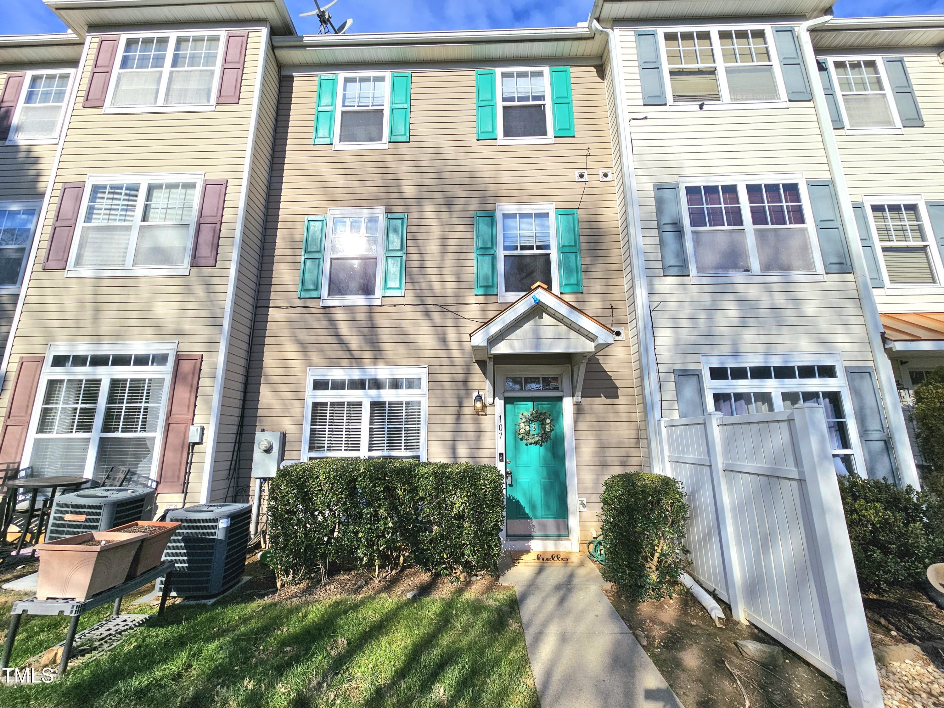 2220 Valley Edge Drive, Unit 107 Raleigh, NC 27614 - Photo 3 of 24 a front view of a house with a yard
