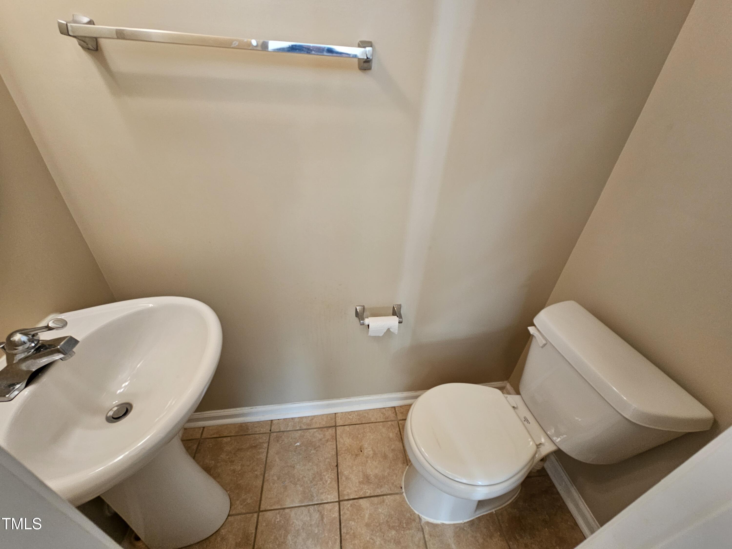 2220 Valley Edge Drive, Unit 107 Raleigh, NC 27614 - Photo 9 of 24 a bathroom with a toilet and a sink